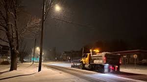 Snow-covered road with blizzard warning sign – Massive Winter Storm